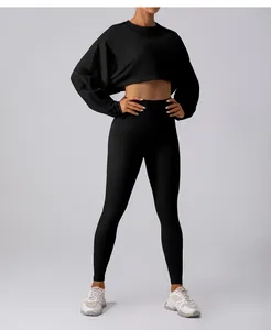 Professional detail of black loose cropped round neck sweatshirt with yoga leggings set