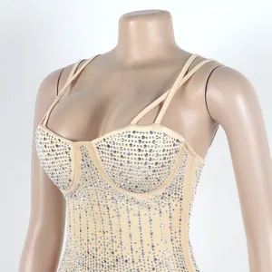Dettaglio di un body in mesh color carne con fitti strass argentati.