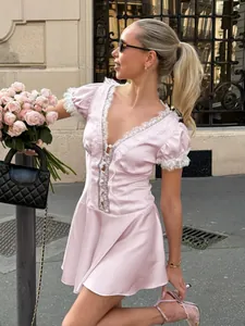 Elegant pink French style V-neck lace dress with puff sleeves and flared A-line skirt