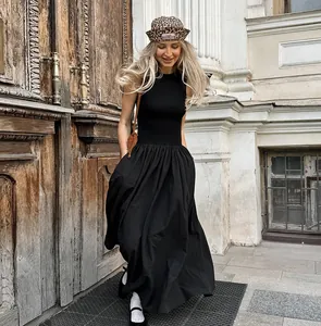 Retro Hepburn style little black maxi dress with knit top and voluminous skirt.