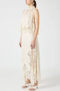 Elegant cream sleeveless lace two-piece set featuring long skirt with slit details