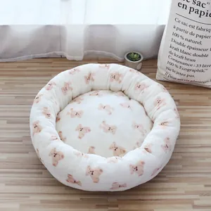 Soft and cozy round pet bed with cute teddy bear pattern for small dogs and cats.