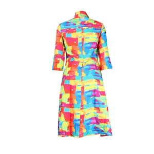 Back view of a slim fit A-line dress featuring vibrant abstract colorful block patterns