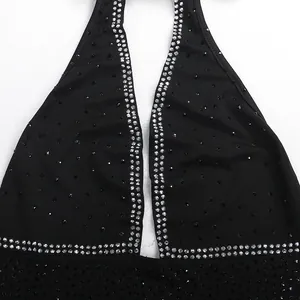 Close-up of black halter dress with sparkling rhinestone embellishments for night clubwear.