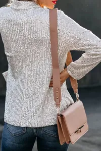 Detail view of a stylish silver sequined blazer for women, perfect for festive parties.