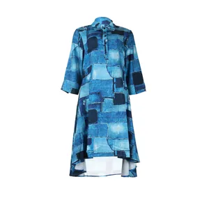Detail showing the denim-style patchwork print and high-low hem of the blue midi dress