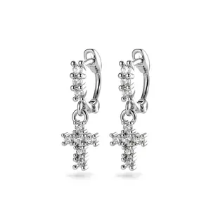 Elegant silver cross pendant hoop earrings with micro-paved cubic zirconia.