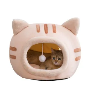 Warm and cozy semi-enclosed plush cat bed shaped like a cat head with a hanging ball