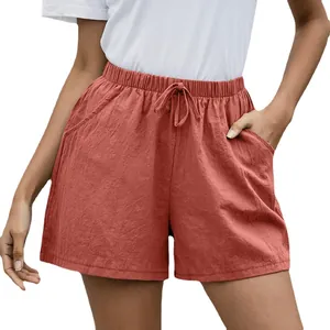 Pantalones cortos de lino naranja para mujer con cintura elástica y bolsillos