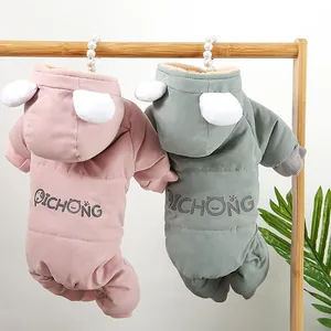 Close-up rear view of thick fleece dog winter jumpsuits in soft pink and sage green