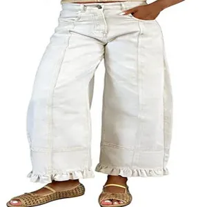 Retro Y2K high-waisted wide-leg denim pants with ruffled hem detail in off-white finish