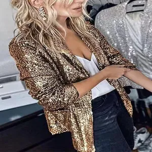 Detail view of women's gold sequin long sleeve blazer jacket with shimmering texture