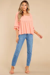 Elegant coral square neck blouse with pleated detail and ruffled medium sleeves