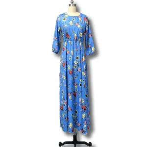 Bohemian style blue floral maxi dress with long sleeves and elegant flared skirt
