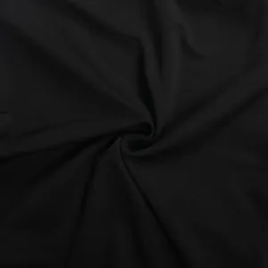 Detailed close-up view of black stretchy fabric texture with subtle rhinestone sparkles