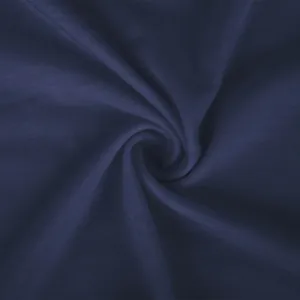 Detailed macro shot of dark navy blue knitted fabric texture with soft silk drape