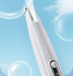 Close-up of pet electric hair trimmer showing the precision blade and built-in LED light.