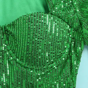 Detailed macro view showing the texture of shimmering green sequins on a nightclub dress