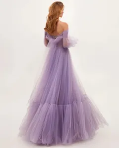 Detailed back view of an elegant purple off-the-shoulder tulle gown with mesh sleeves.