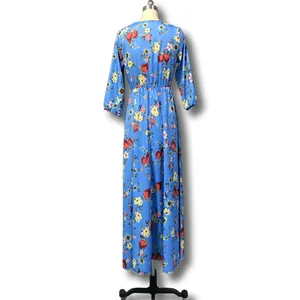 Back view detail of a bohemian blue floral print maxi dress on a display mannequin