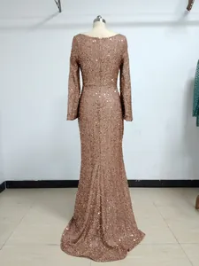 Detailed back view of a sequined rose gold evening gown displayed on a mannequin