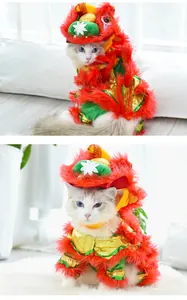 Detailed view of a white cat wearing a festive Chinese Lion Dance costume for pets