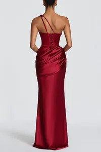 Detailed back view of a red satin one-shoulder mermaid dress with corset lacing