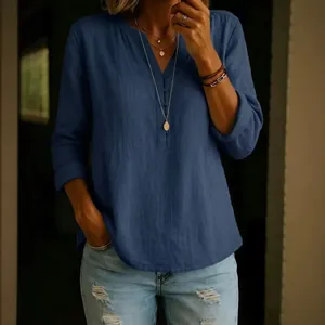 Elegant women's casual blue linen V-neck button-down long-sleeved shirt blouse top.