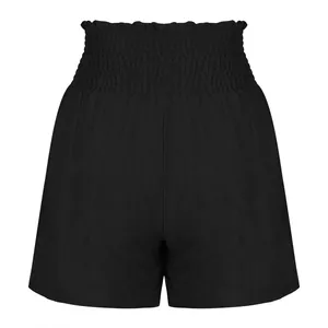 Close-up detail of high-waisted smocked waistband on these black summer sports shorts
