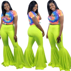 Conjunto sexy de mujer con pantalones acampanados verde neón con volantes y top tie-dye