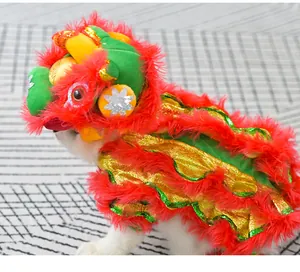 Detail of festive red Chinese lion dance pet costume with gold sequins and plush fur