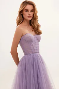 Detail of elegant lavender tulle evening gown with pleated corset bodice and skirt