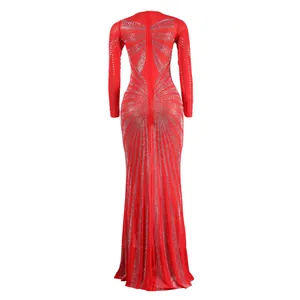 Detail view of an elegant red floor-length gown with radiant rhinestone patterns