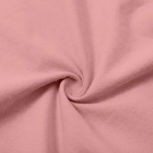 Detailed close-up of soft pink cotton-linen fabric texture with natural weave pattern.
