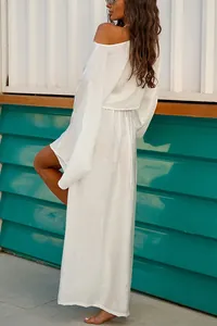 Detailed back view of a breezy white two-piece long sleeve top and maxi skirt set for women