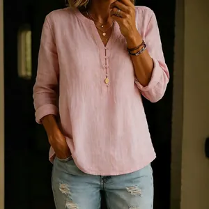 Elegant pink cotton linen V-neck blouse with buttons and rolled long sleeves for women