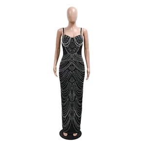 Detailed view of elegant black evening gown with intricate pearl beading and rhinestones