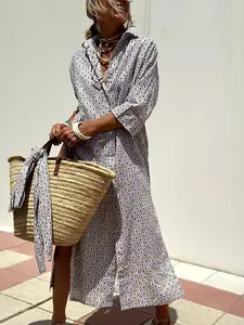 Stylish bohemian geometric print maxi shirt dress with 5/4 sleeves and lapel detail