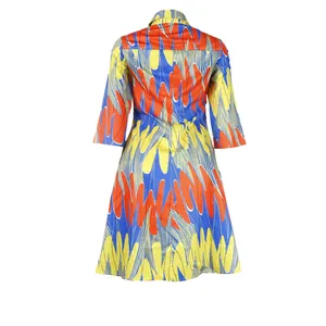 Back view of a vibrant colorful dress with bold abstract patterns and a slim fit design.