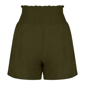 Detail shot of women's olive green shorts with high smocked elastic waistband.