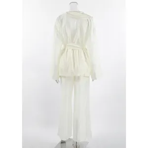 Back view of elegant cream Tencel wrap top with ruffles and matching wide leg pants