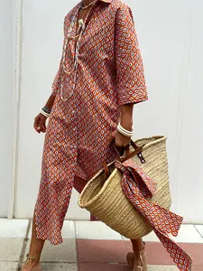 Bohemian chic orange geometric pattern shirt dress with mid-length sleeves and collar