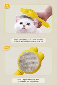 Detail showing effective pet hair removal with a yellow rabbit-ear grooming brush on a white cat