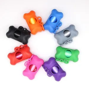 Variety of colorful bone-shaped dog poop bag dispensers with clips for outdoor cleaning