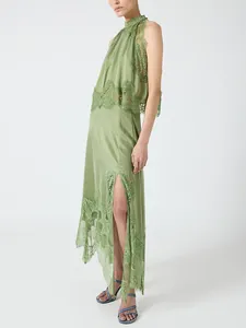 Elegant sage green lace two-piece set featuring a high neck top and side slit skirt.