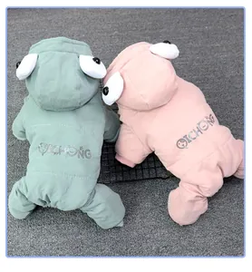 Detail of thick padded winter pet jumpsuits with funny cartoon eyes on hoods in two colors