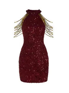 Detailed view of burgundy halter neck sequin mini dress with ornate gold beaded fringe