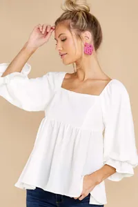 Elegant white square neck blouse with puff sleeves and ruffled cuffs for women
