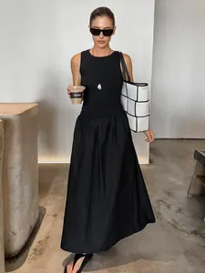 Vintage Hepburn style sleeveless little black dress featuring a slim knitted waistline