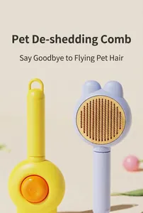 Detail of rabbit ear pet grooming brush with self-cleaning stainless steel pins